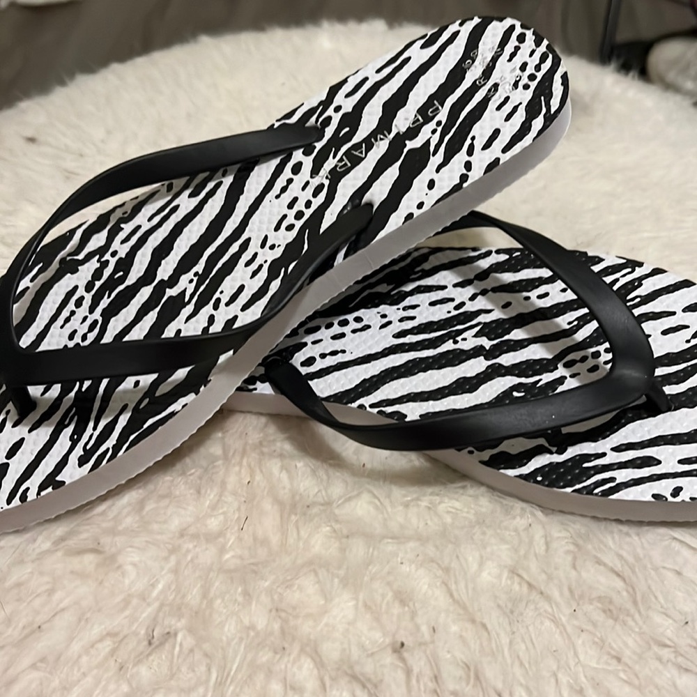 Zebra printed flip-flops